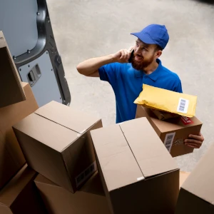 Man talking on the phone in front of boxes