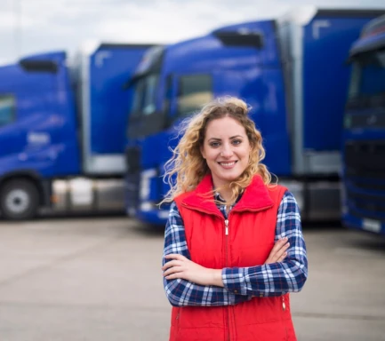 Woman in front of trucks